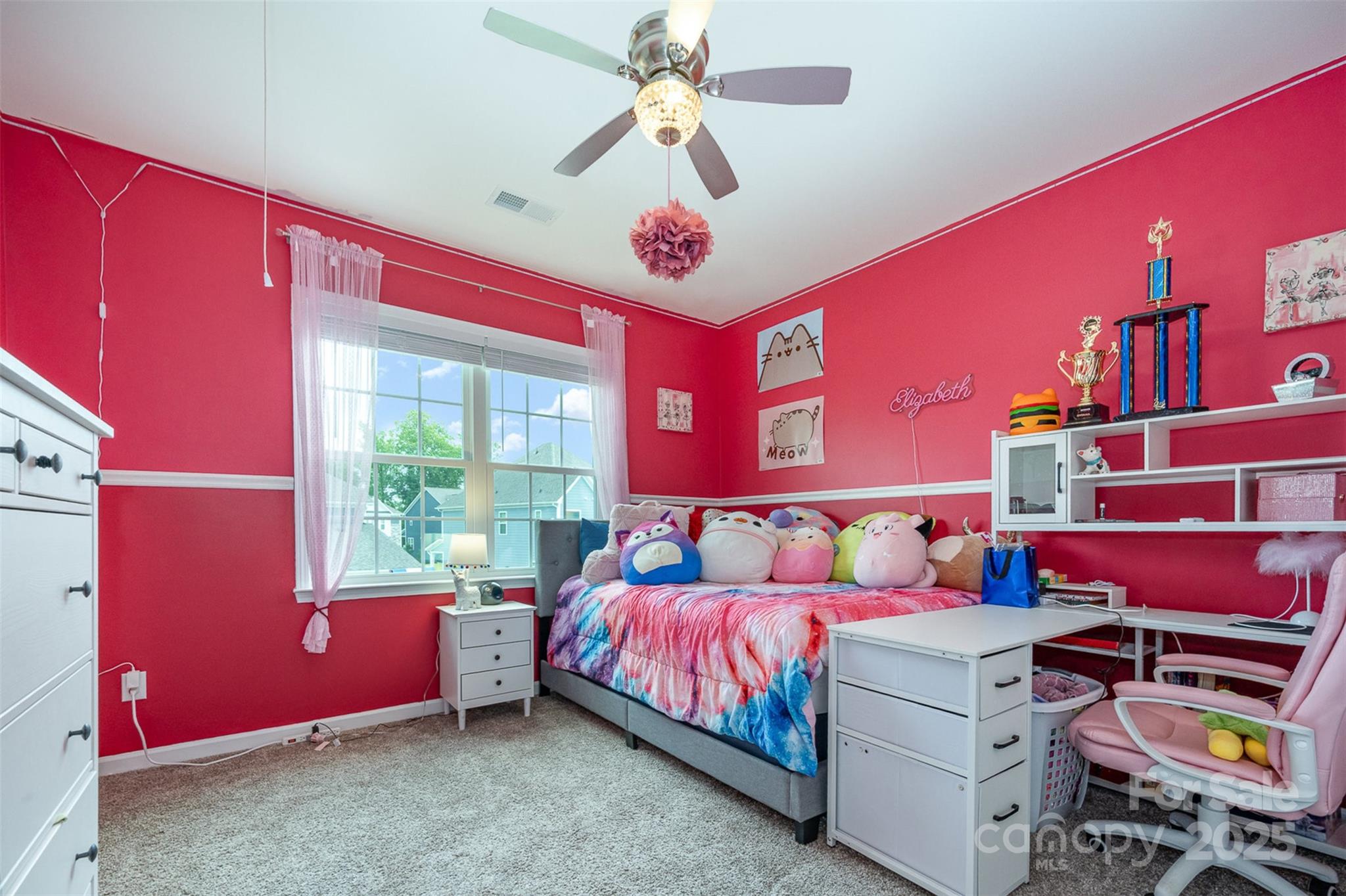 2960 Haley Circle Davidson, NC 28036 - Photo 19 of 31 a bedroom with a bed and a chandelier