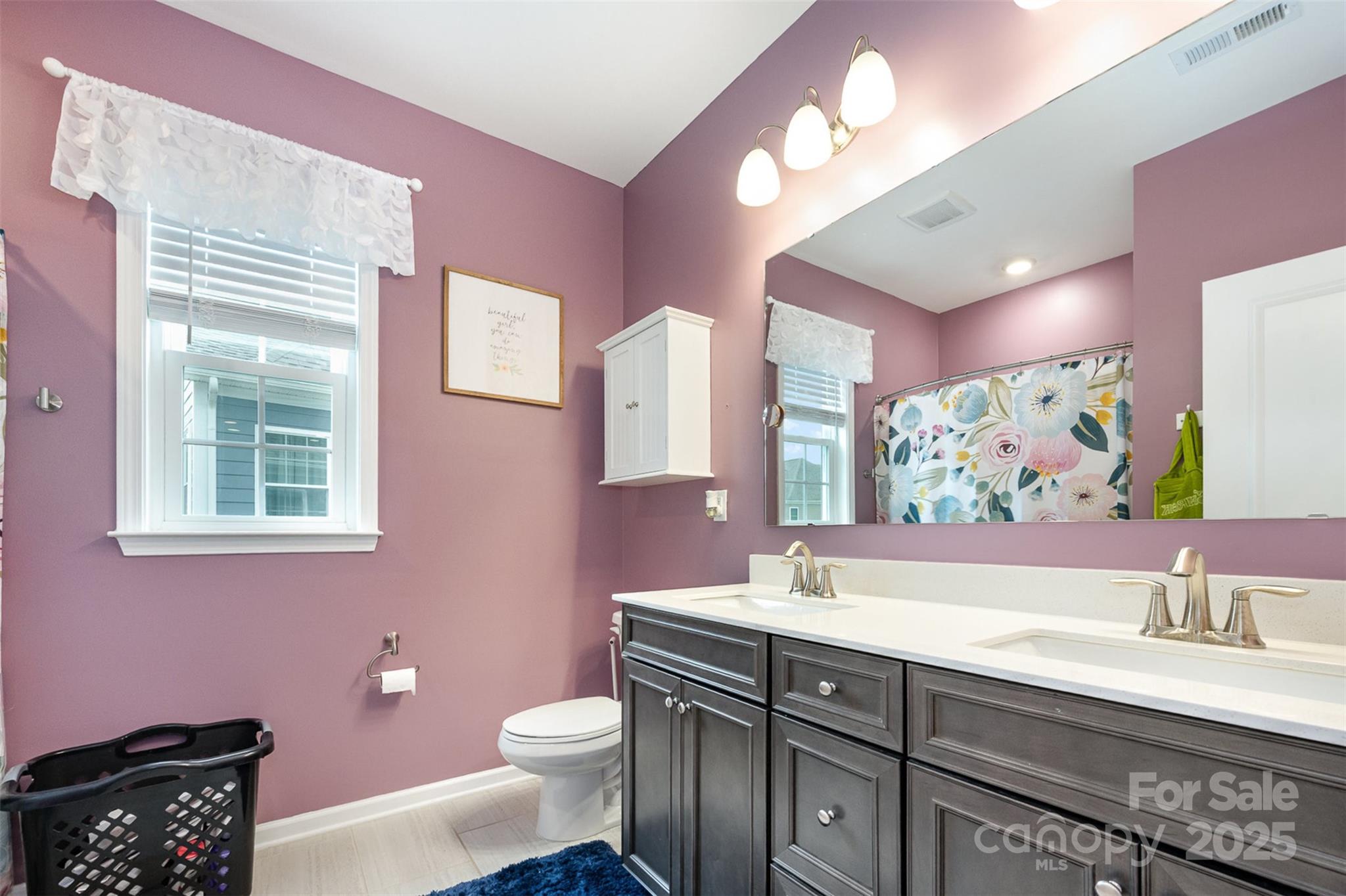 2960 Haley Circle Davidson, NC 28036 - Photo 21 of 31 a bathroom with a sink vanity tub and toilet
