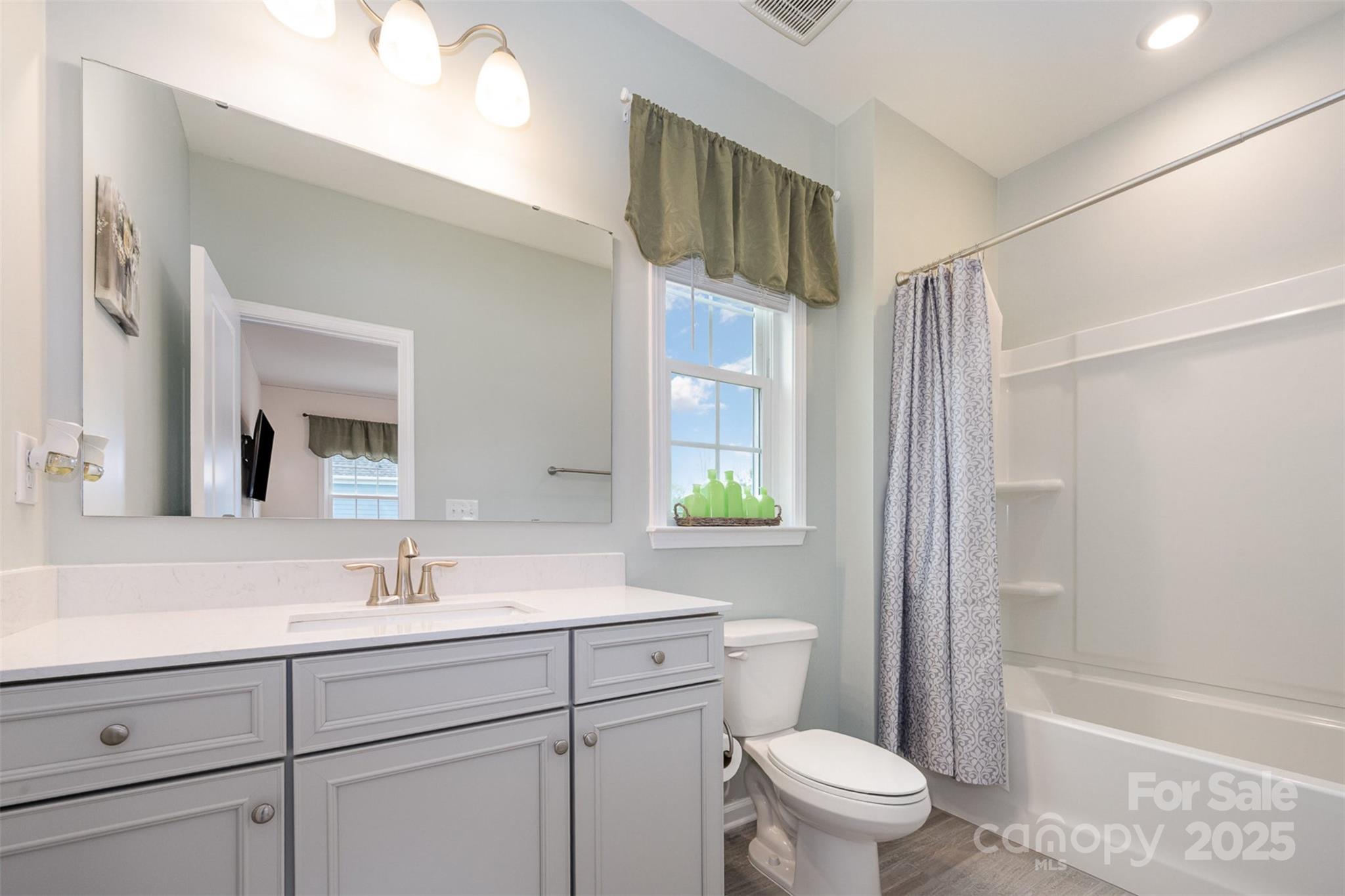 2960 Haley Circle Davidson, NC 28036 - Photo 22 of 31 a bathroom with a sink a toilet and shower