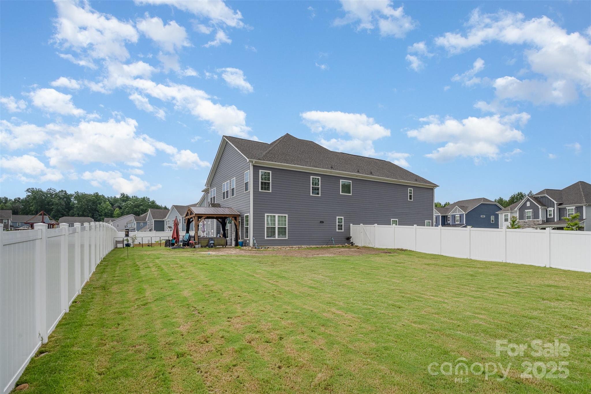 2960 Haley Circle Davidson, NC 28036 - Photo 25 of 31 a view of a house with a big yard and a large tree