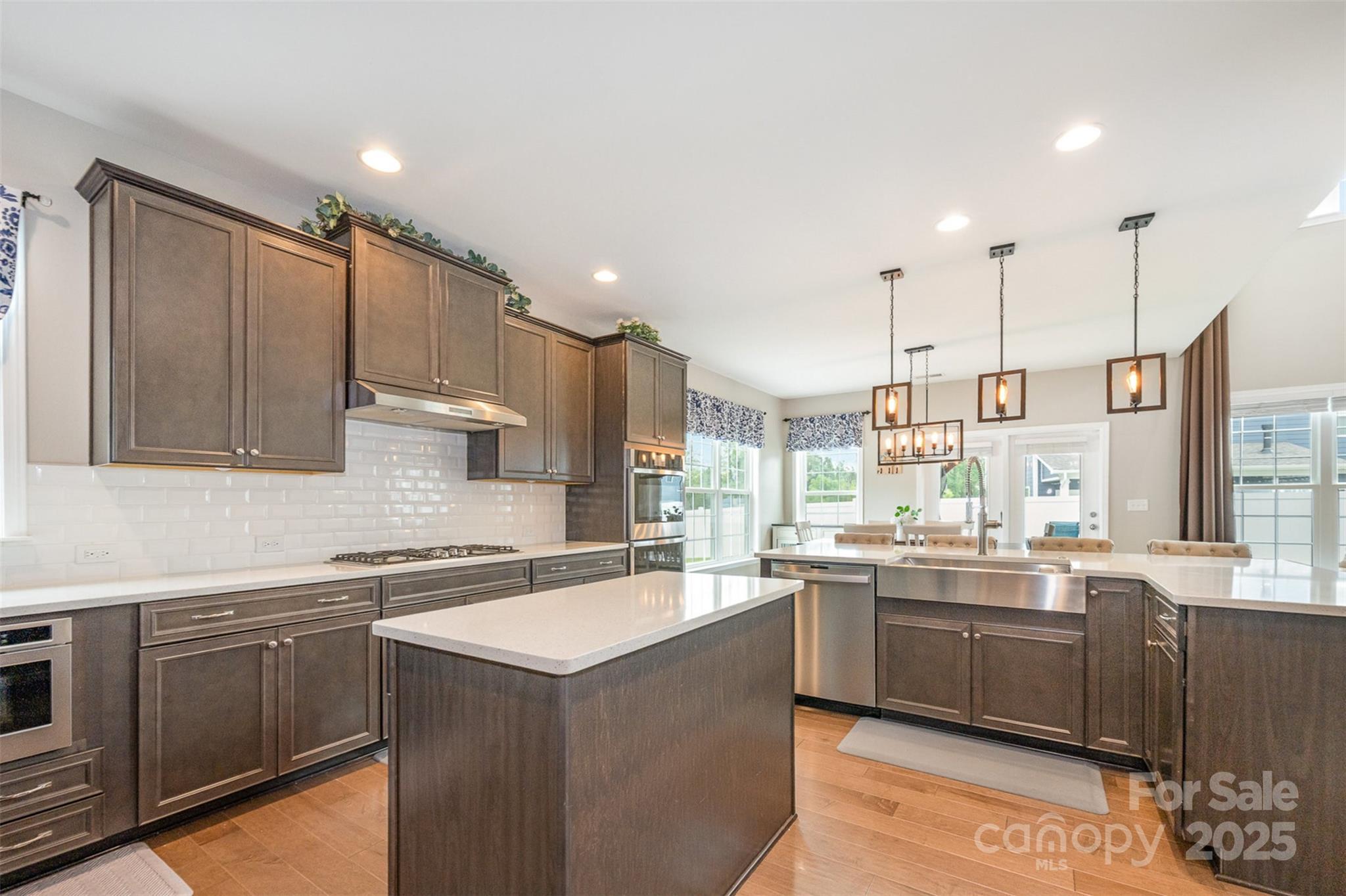 2960 Haley Circle Davidson, NC 28036 - Photo 10 of 31 a kitchen with a sink window and cabinets