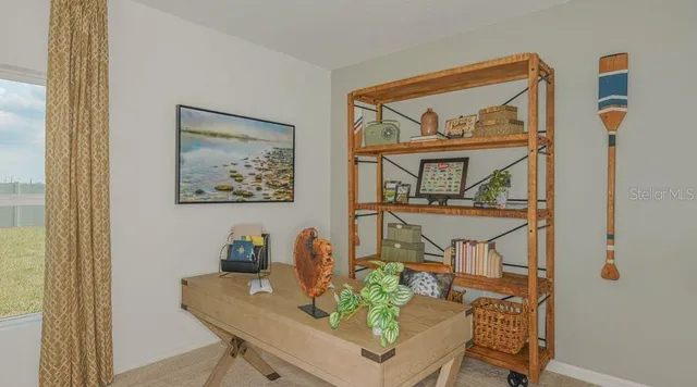 a living room with furniture and a window