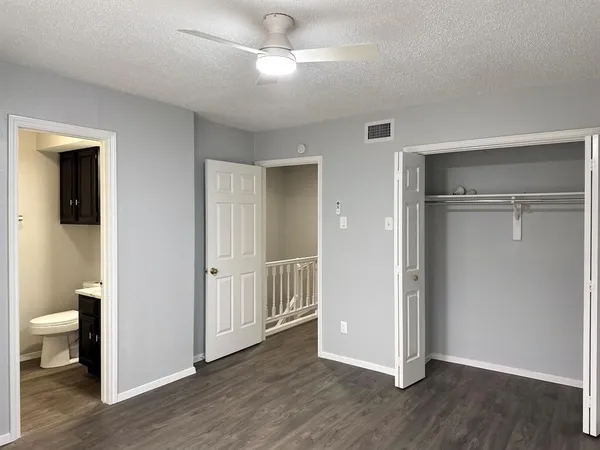 a view of a room with wooden floor