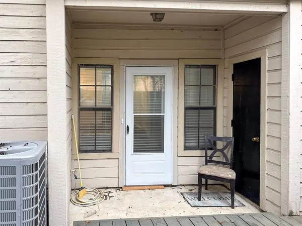 a view of a door and chair and door in the house