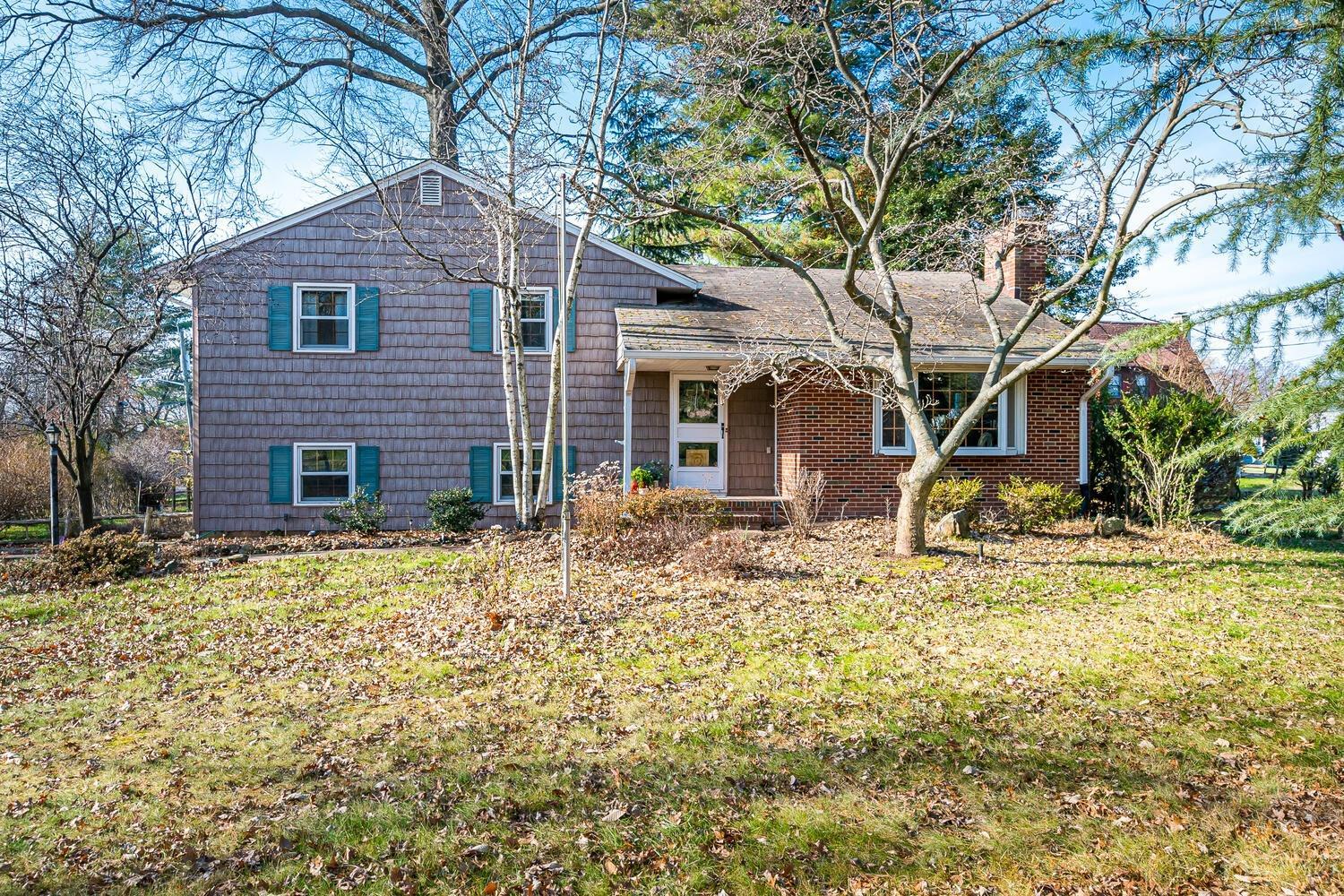 225 Plainfield Road Edison, NJ 08820 - Photo 1 of 1 a view of a brick house with a yard and large tree