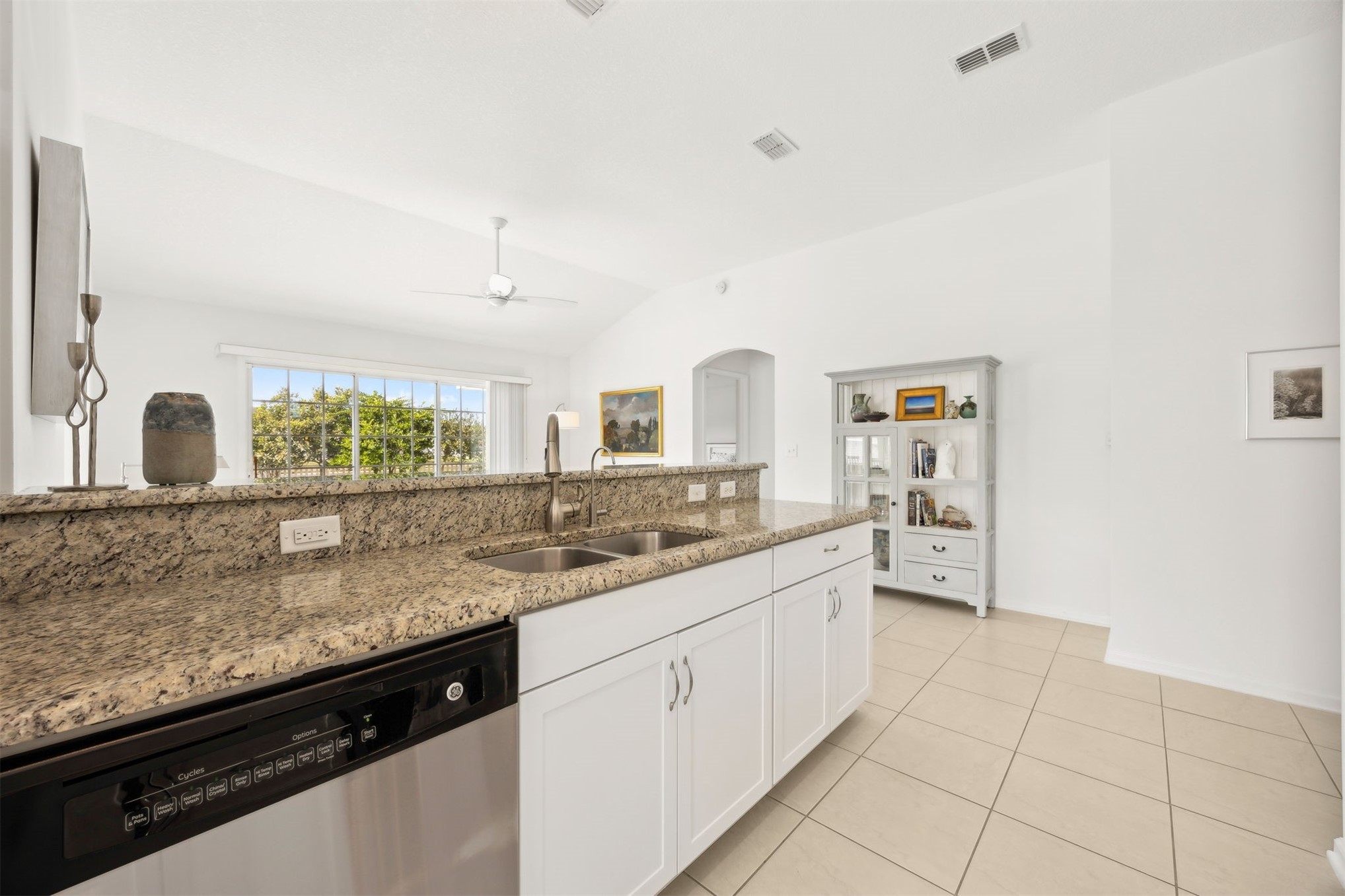 94037 Last Lane Yulee, FL 32097 - Photo 10 of 38 a kitchen with granite countertop a sink and cabinets