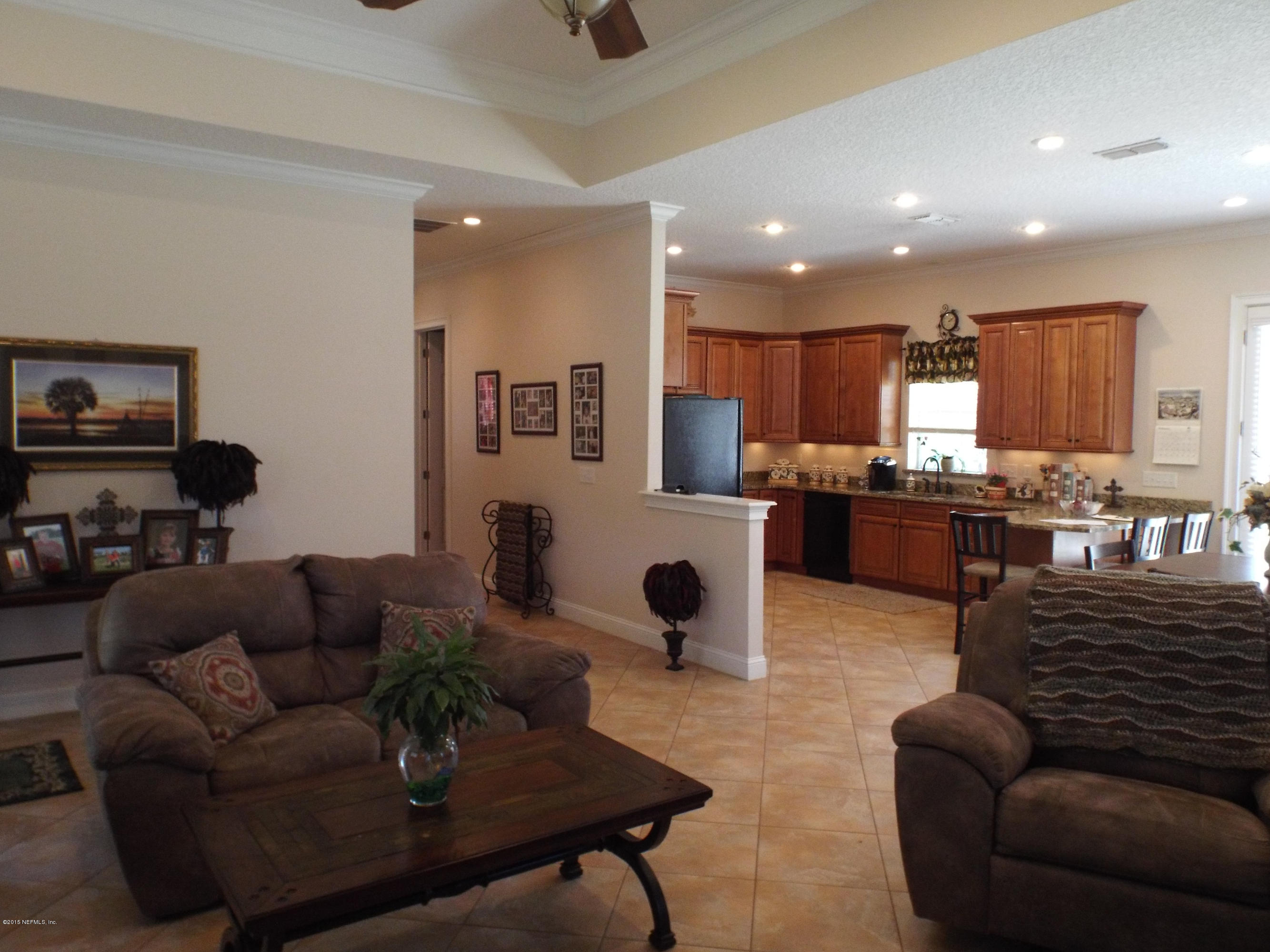 2949 Gobbler Road Middleburg, FL 32068 - Photo 9 of 39 Family Room Leading to the Kitchen
