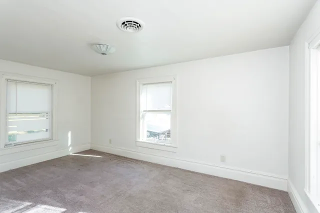 an empty room with windows