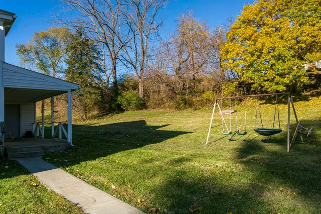 a view of yard with swimming pool