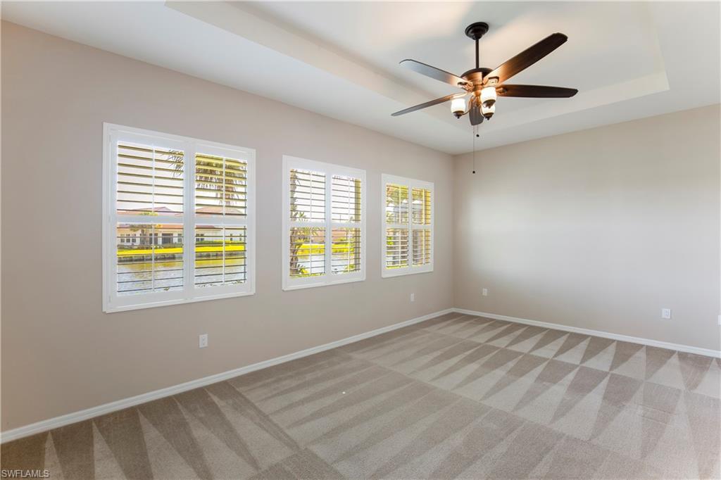 13515 Cambridge Lane Naples, FL 34109 - Photo 11 of 28 a view of an empty room with a window