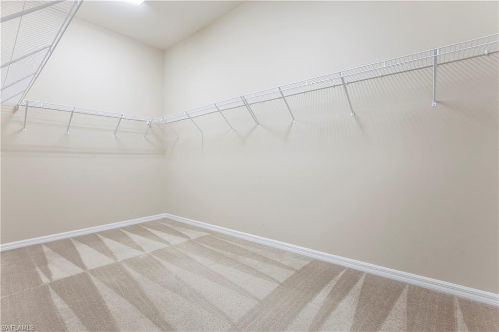 13515 Cambridge Lane Naples, FL 34109 - Photo 13 of 28 a view of a room with racks on the wall
