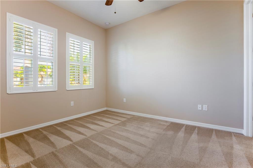 13515 Cambridge Lane Naples, FL 34109 - Photo 16 of 28 an empty room with a window