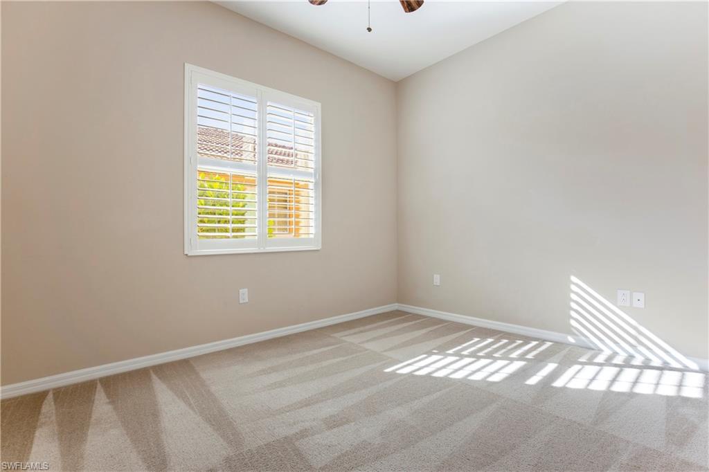 13515 Cambridge Lane Naples, FL 34109 - Photo 18 of 28 a view of an empty room with a window