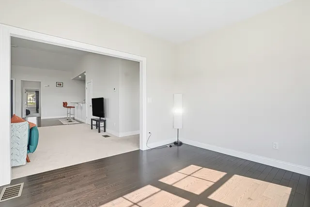 a view of a living room with a flat screen tv