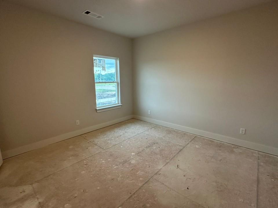 585 Brown Road Leonard, TX 75452 - Photo 25 of 29 Interior room featuring light-colored walls and a single window with white trim