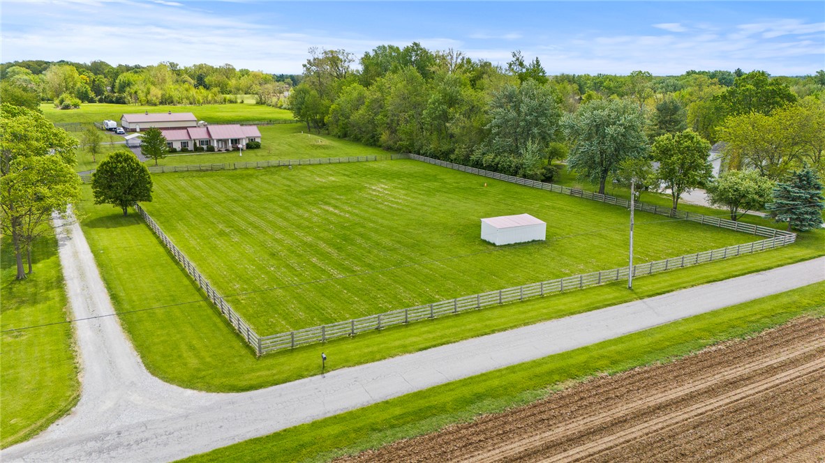 4222 Ramsey Road Springfield, OH 45502 - Photo 1 of 79 Expansive green grounds feature a ranch-style residence and a spacious outbuilding.