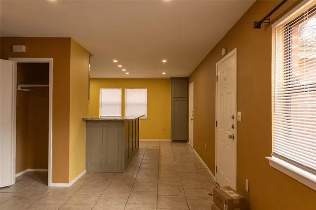 a view of a hallway with a window