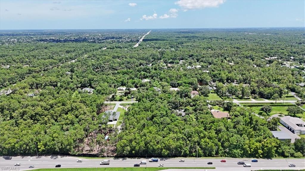 5665 Napa Woods Way Naples, FL 34116 - Photo 12 of 20 an aerial view of a house with a yard