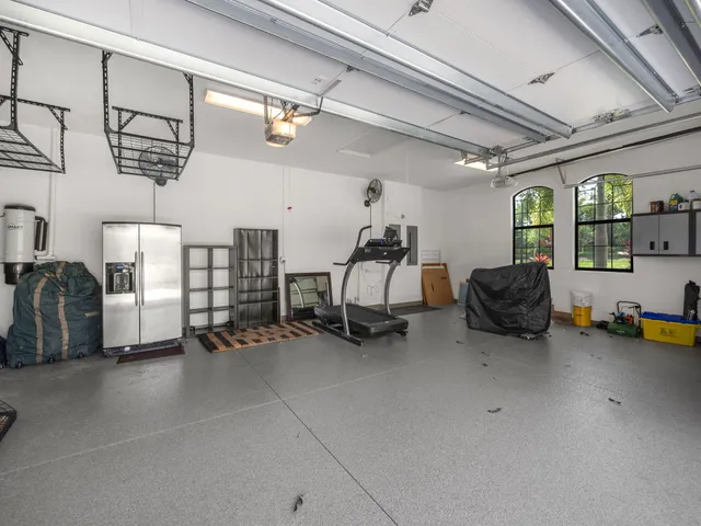 a view of a gym area with gym equipment
