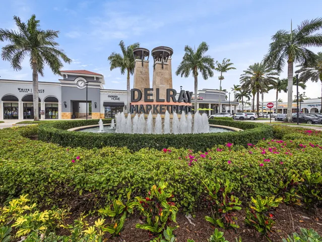 a front view of multiple houses with yard
