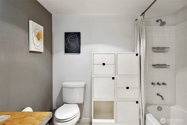 a white toilet sitting next to a bathroom sink