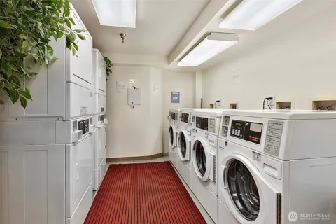 a view of a kitchen with washer and dryer