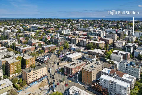 an aerial view of a building with parking space