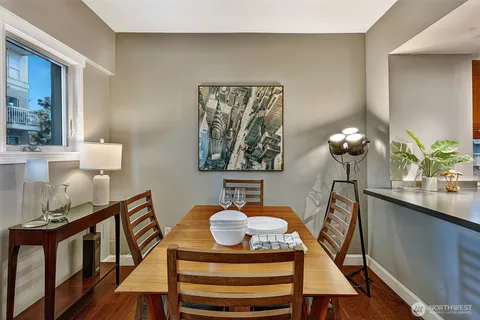 a dining room with furniture and chandelier