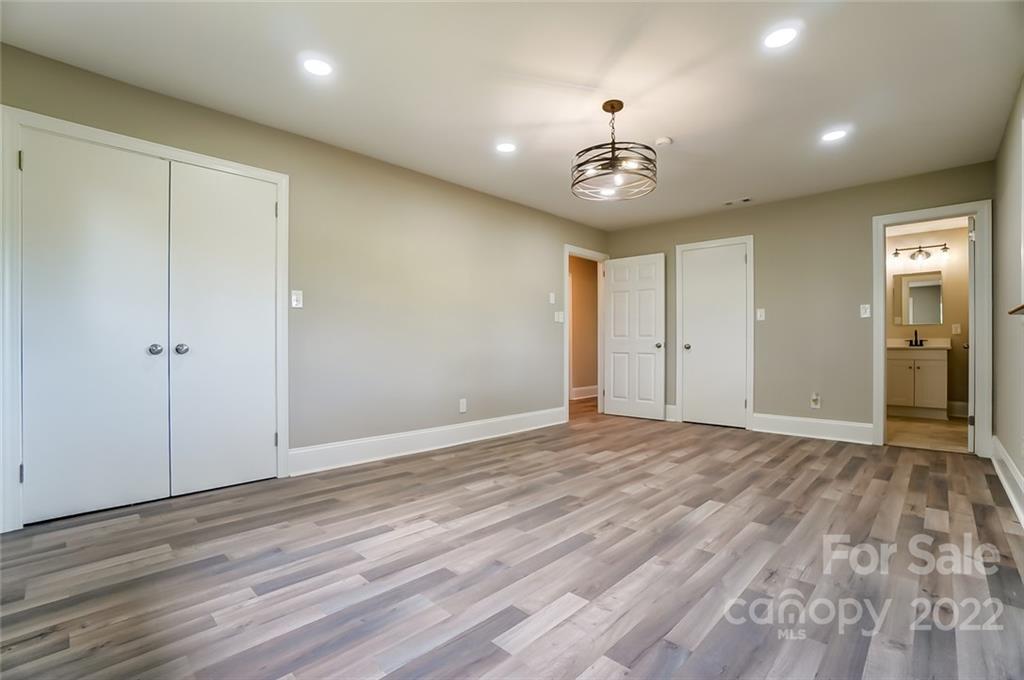3001 Morgan Mill Road Monroe, NC 28110 - Photo 27 of 36 wooden floor in an empty room with a window