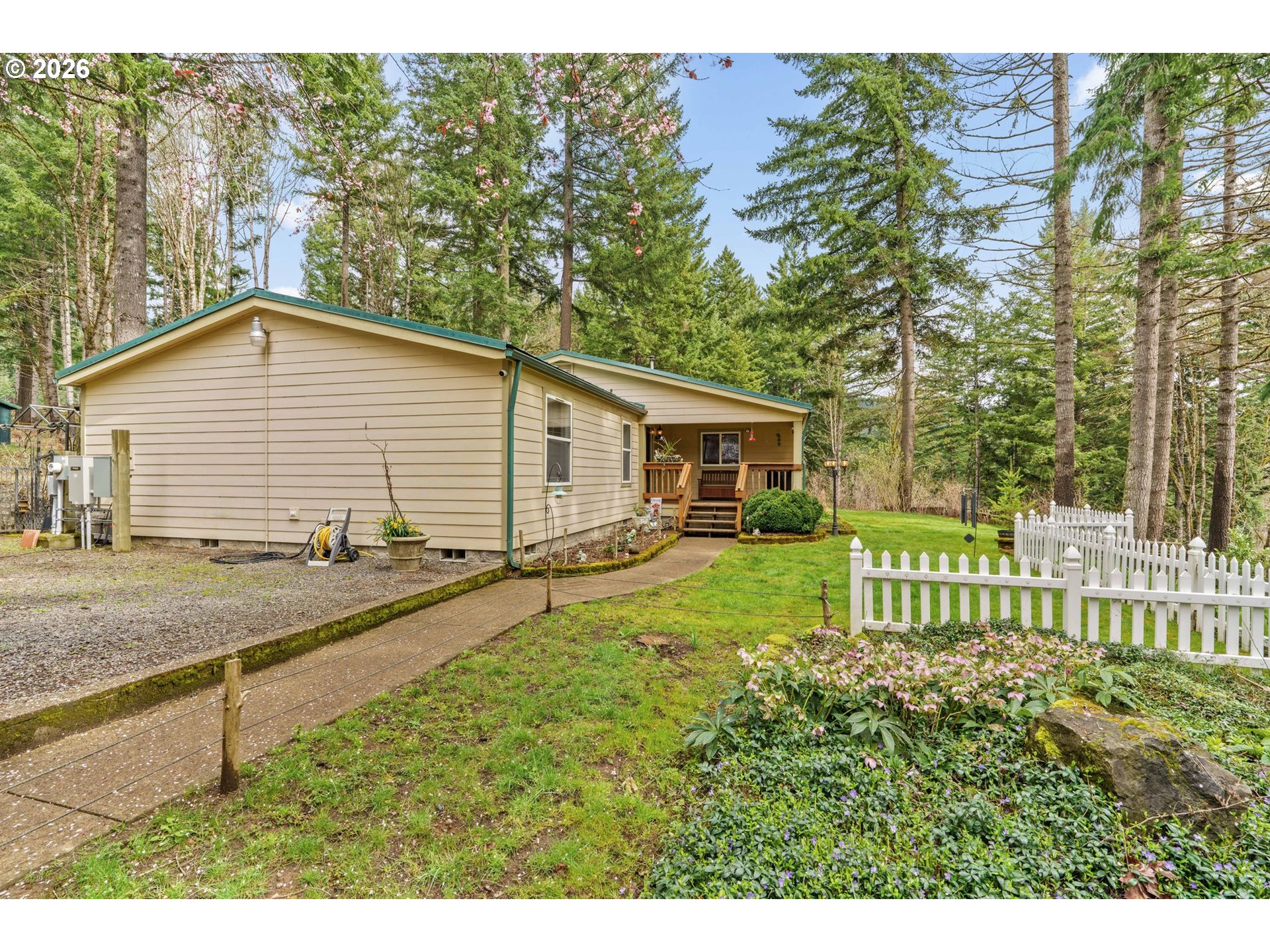 49400 Eagle Rock Place Vida, OR 97488 - Photo 1 of 48 a view of a house with backyard and a tree