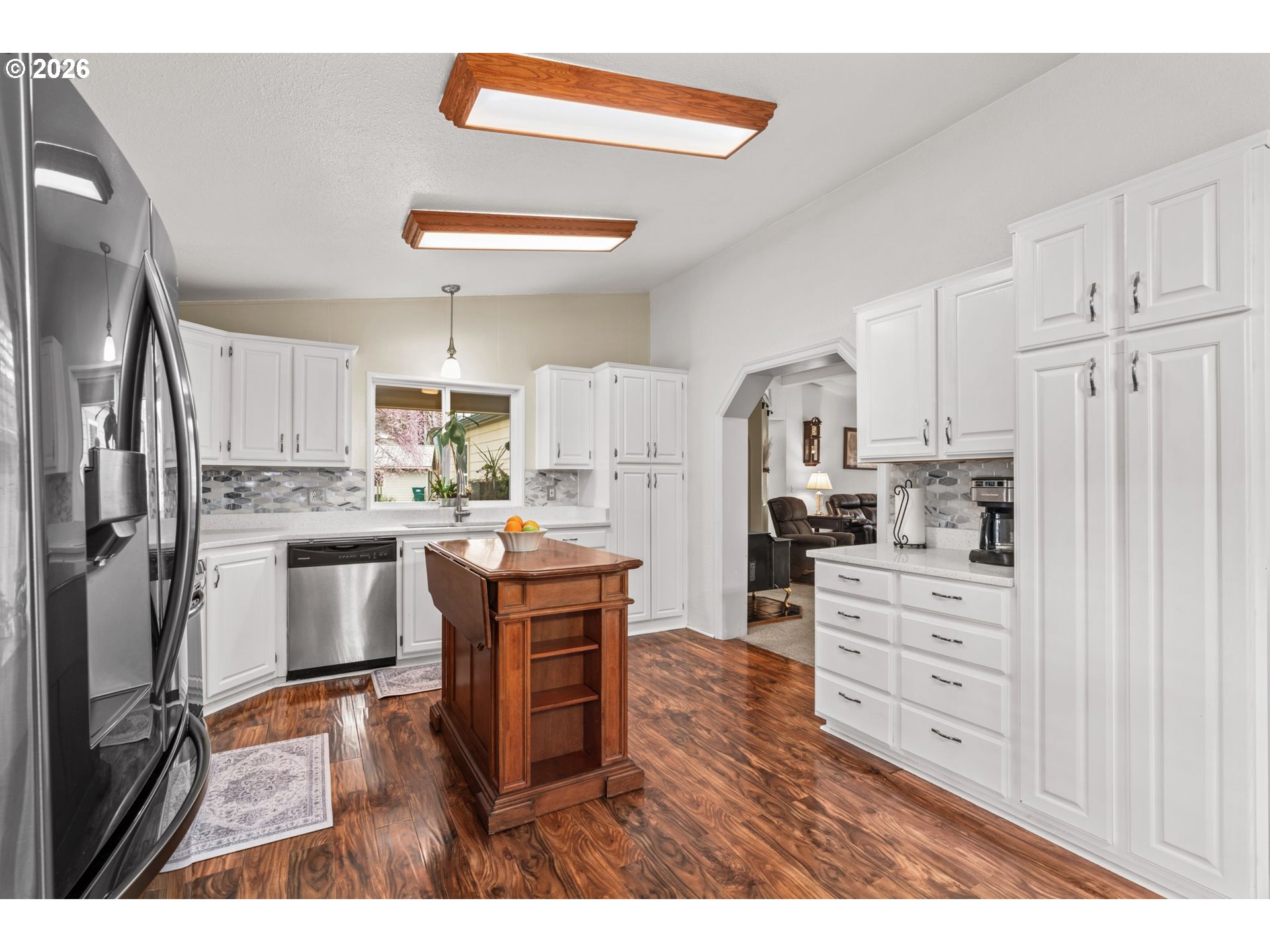 49400 Eagle Rock Place Vida, OR 97488 - Photo 13 of 48 a kitchen with white cabinets and stainless steel appliances
