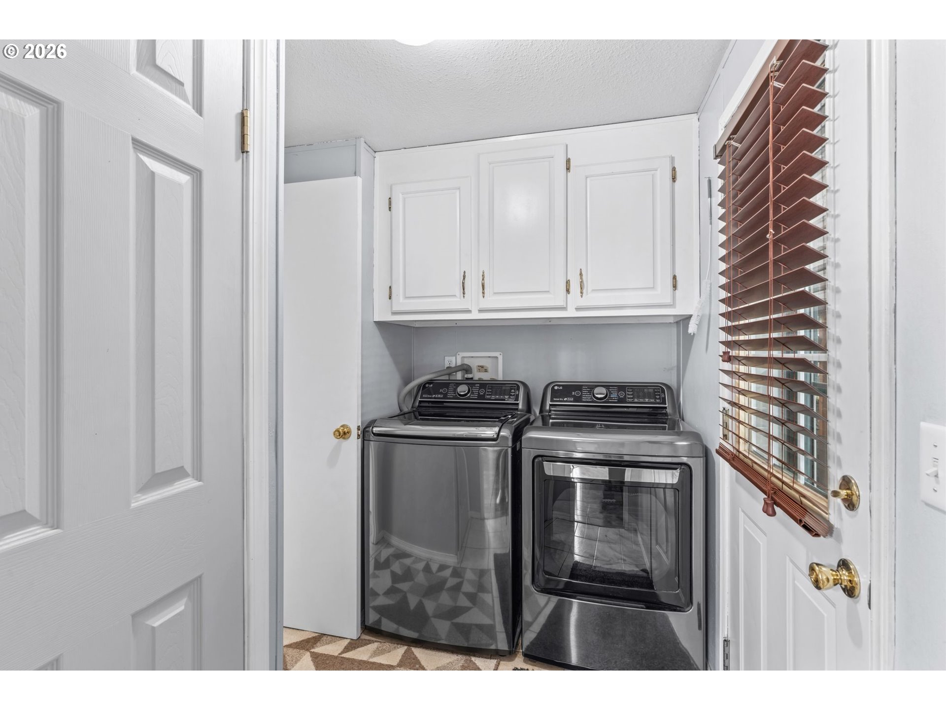 49400 Eagle Rock Place Vida, OR 97488 - Photo 15 of 48 a kitchen with stainless steel appliances granite countertop a stove and a microwave