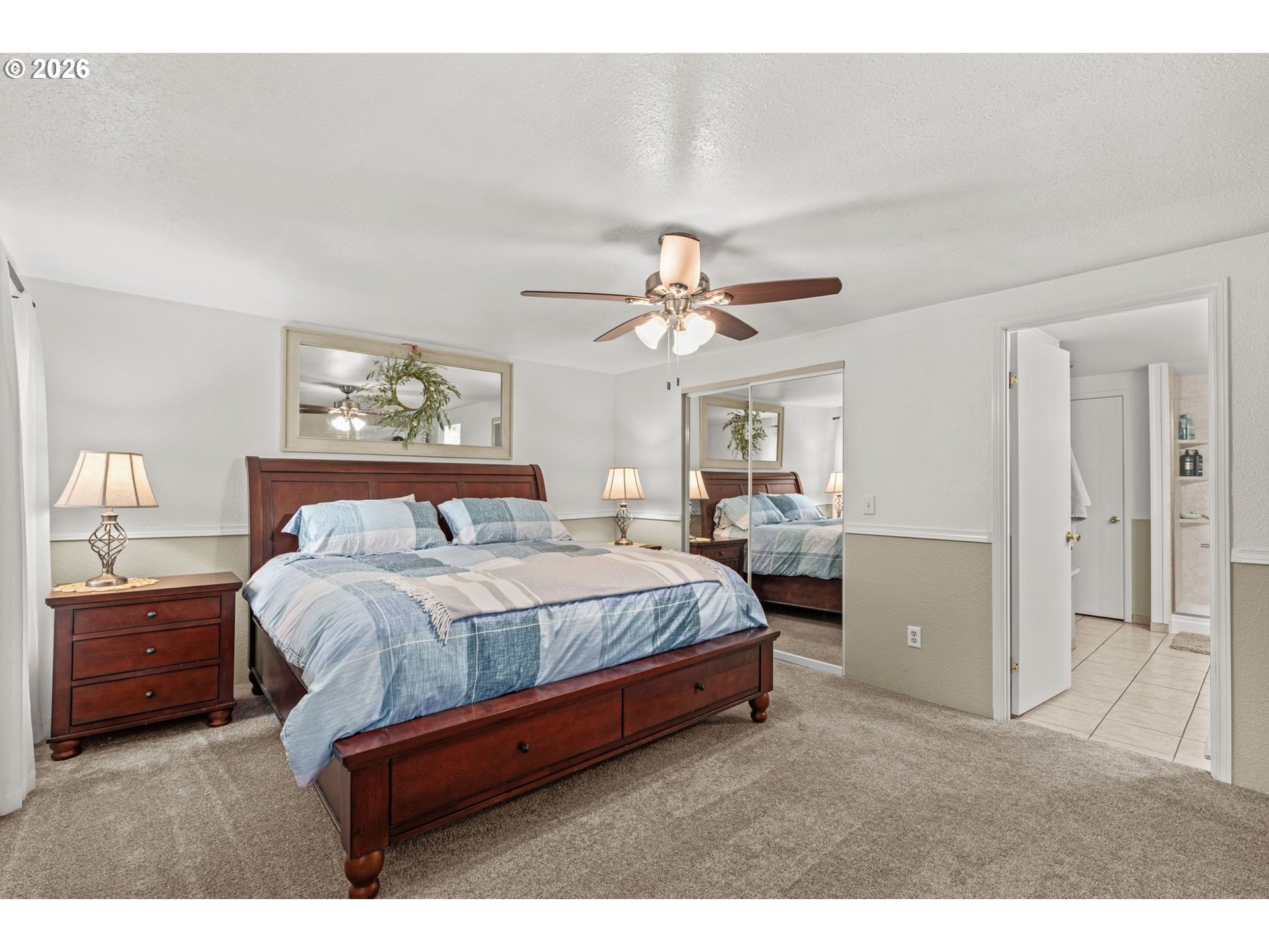 49400 Eagle Rock Place Vida, OR 97488 - Photo 17 of 48 a bedroom with a bed and a chandelier