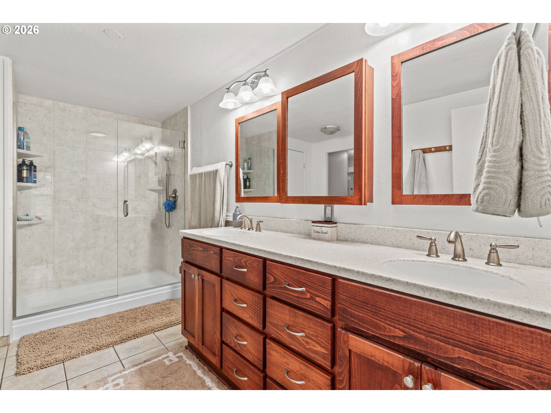 49400 Eagle Rock Place Vida, OR 97488 - Photo 19 of 48 a bathroom with a double vanity sink mirror and shower