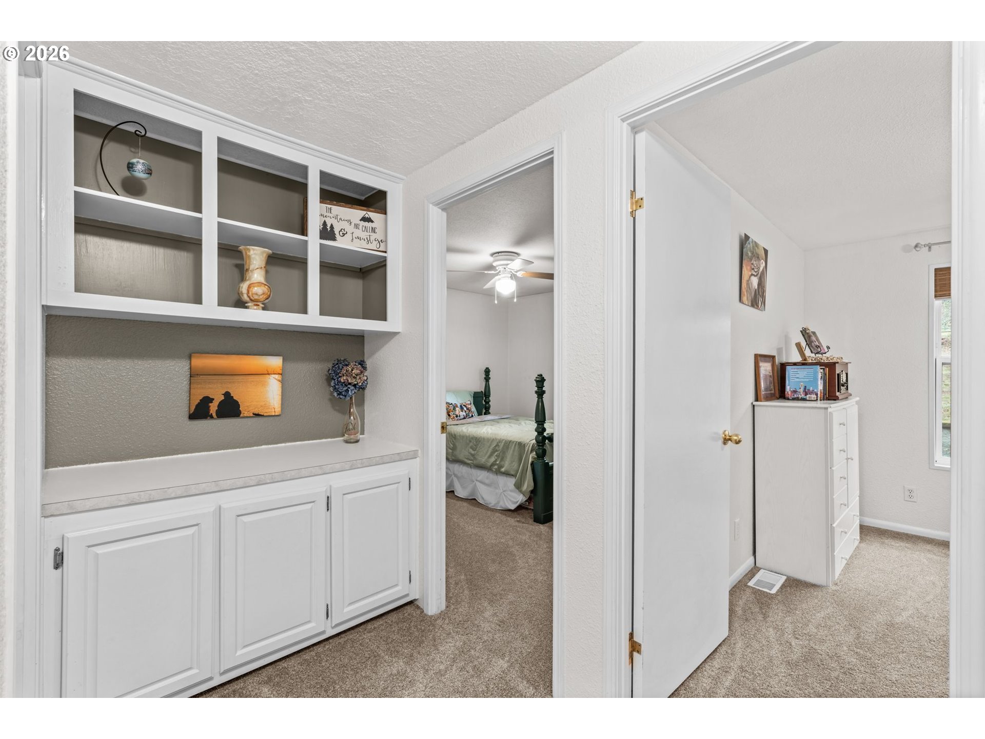 49400 Eagle Rock Place Vida, OR 97488 - Photo 21 of 48 a hallway with white cabinets and white appliances