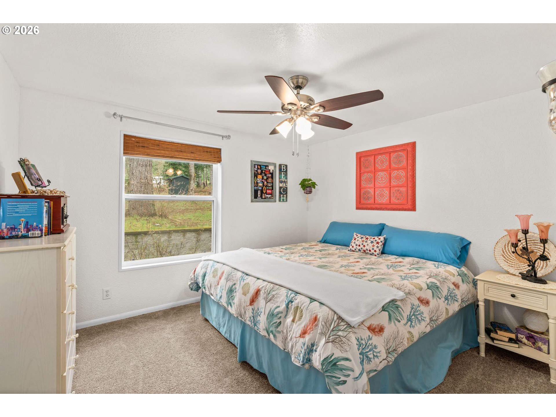 49400 Eagle Rock Place Vida, OR 97488 - Photo 22 of 48 a bedroom with a bed and a chandelier