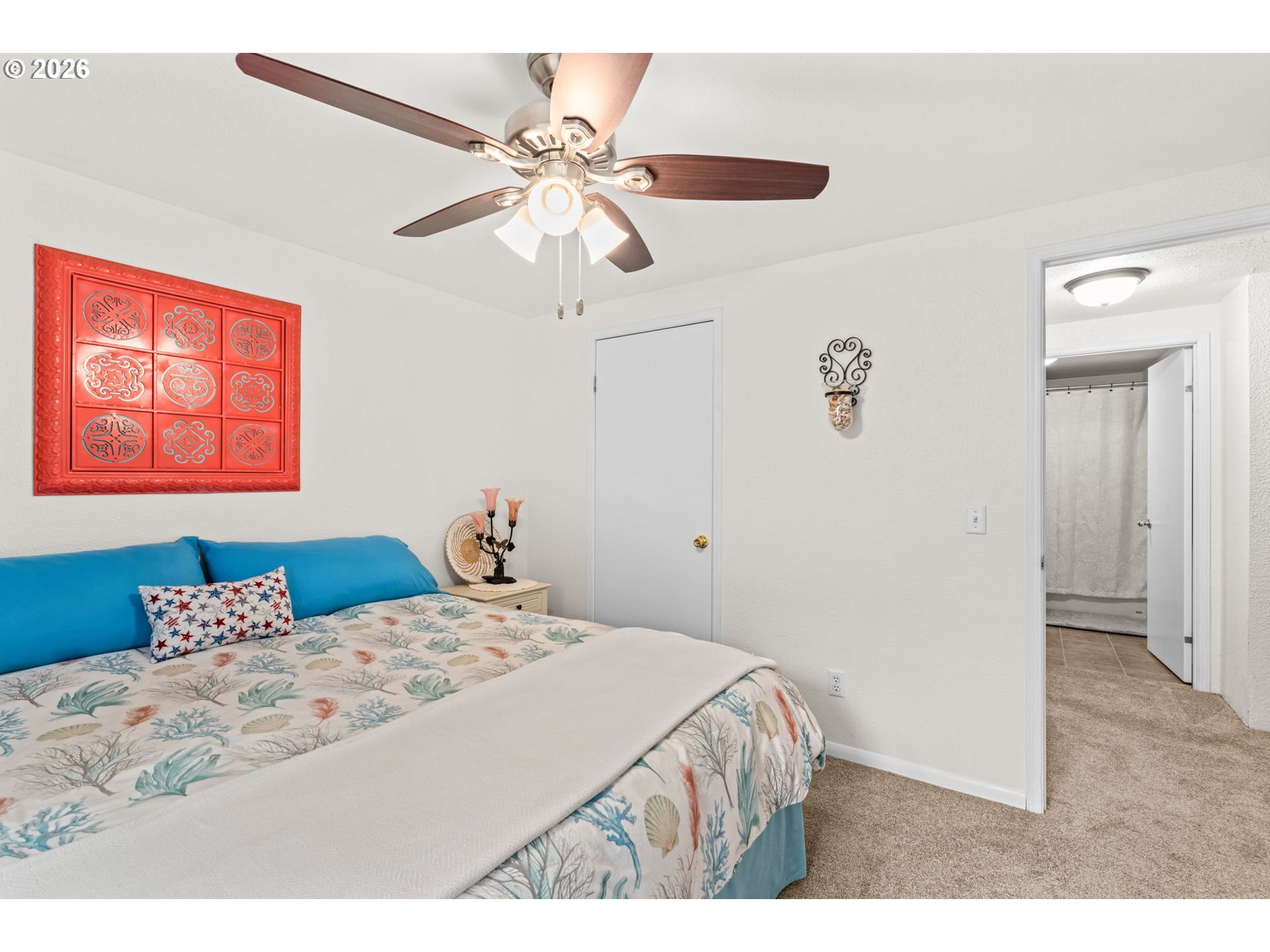 49400 Eagle Rock Place Vida, OR 97488 - Photo 23 of 48 a bedroom with a bed and a chandelier
