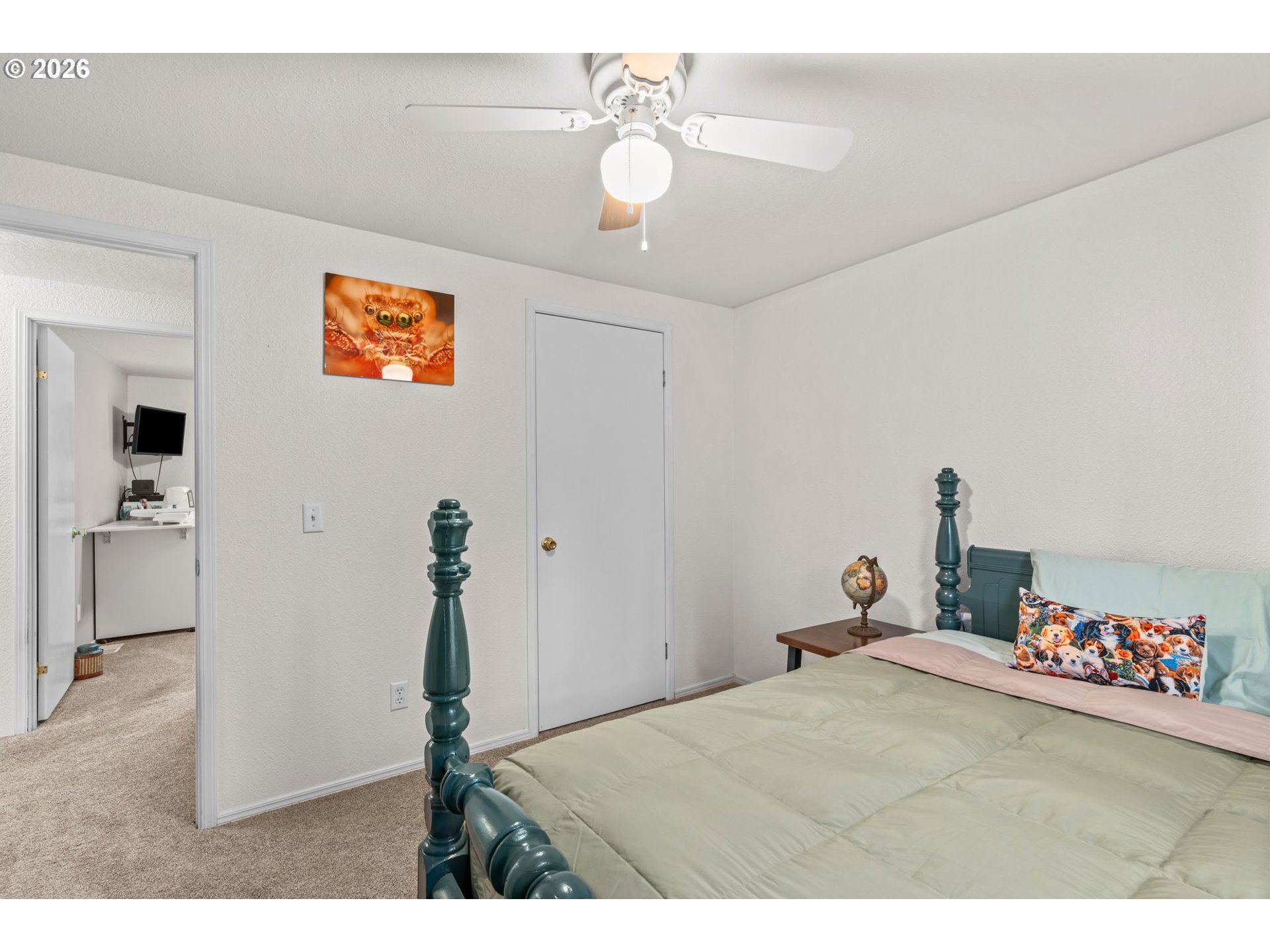 49400 Eagle Rock Place Vida, OR 97488 - Photo 26 of 48 a bedroom with a bed and a chandelier
