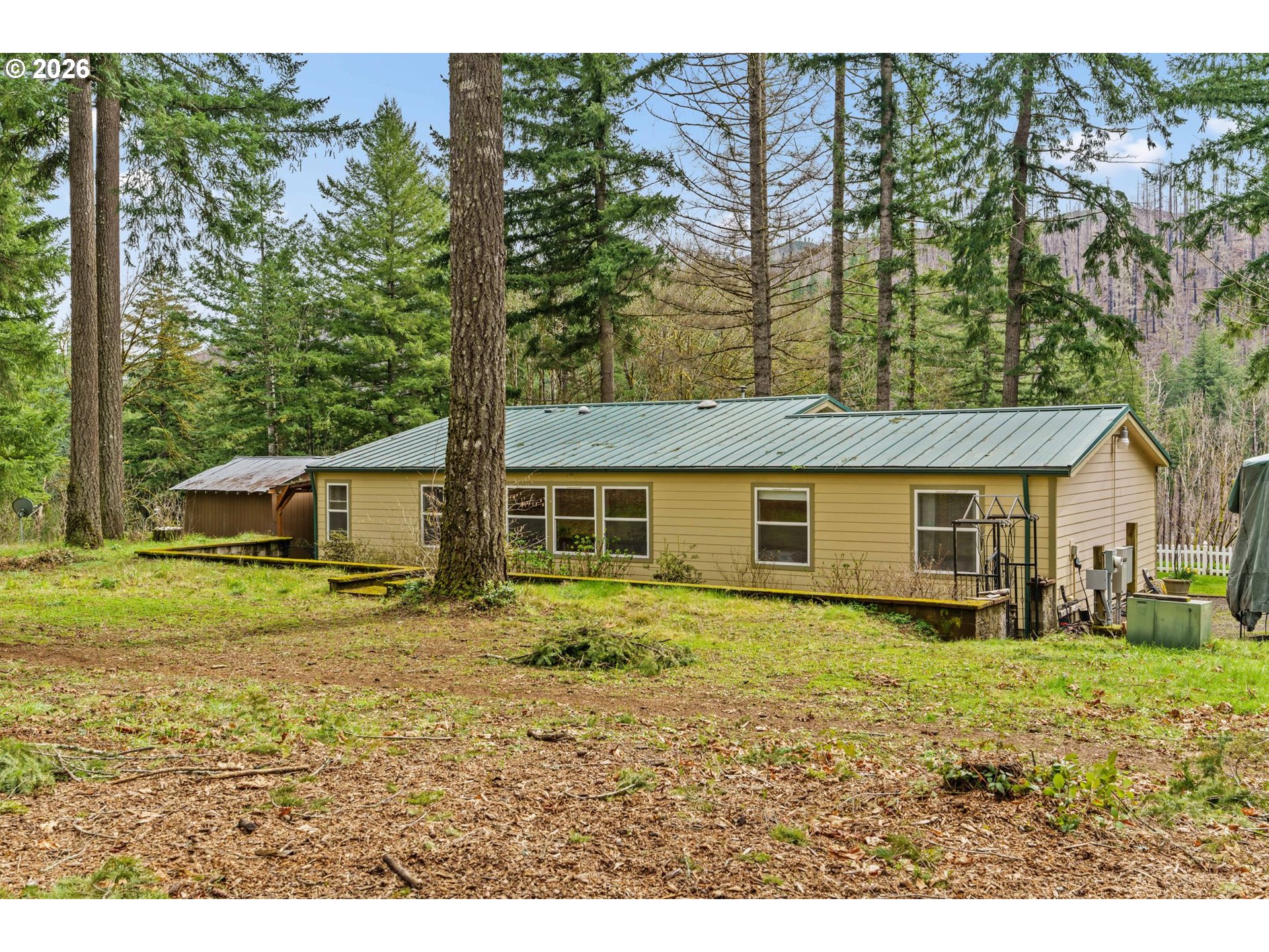 49400 Eagle Rock Place Vida, OR 97488 - Photo 34 of 48 a house view with a outdoor space