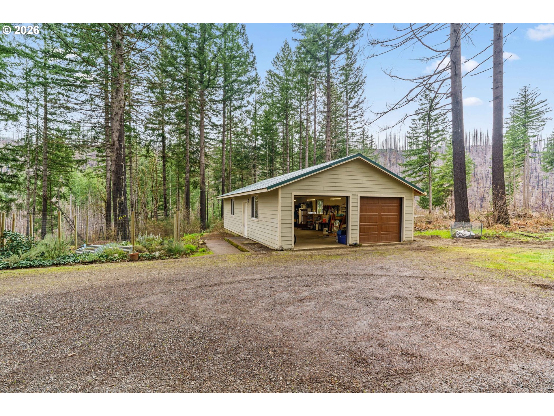 49400 Eagle Rock Place Vida, OR 97488 - Photo 37 of 48 a view of front of a house with a yard and garage