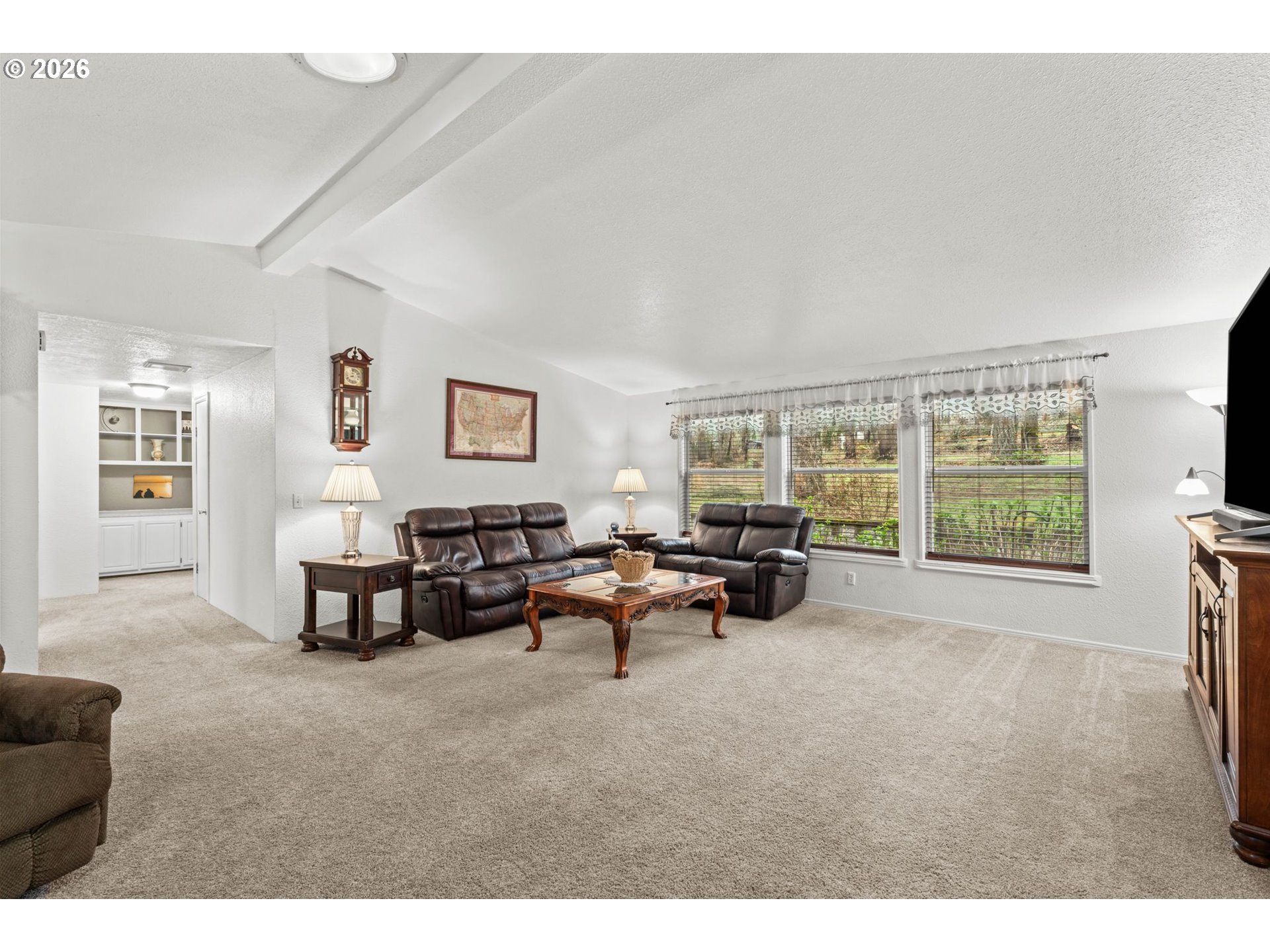 49400 Eagle Rock Place Vida, OR 97488 - Photo 6 of 48 a living room with furniture and a large window