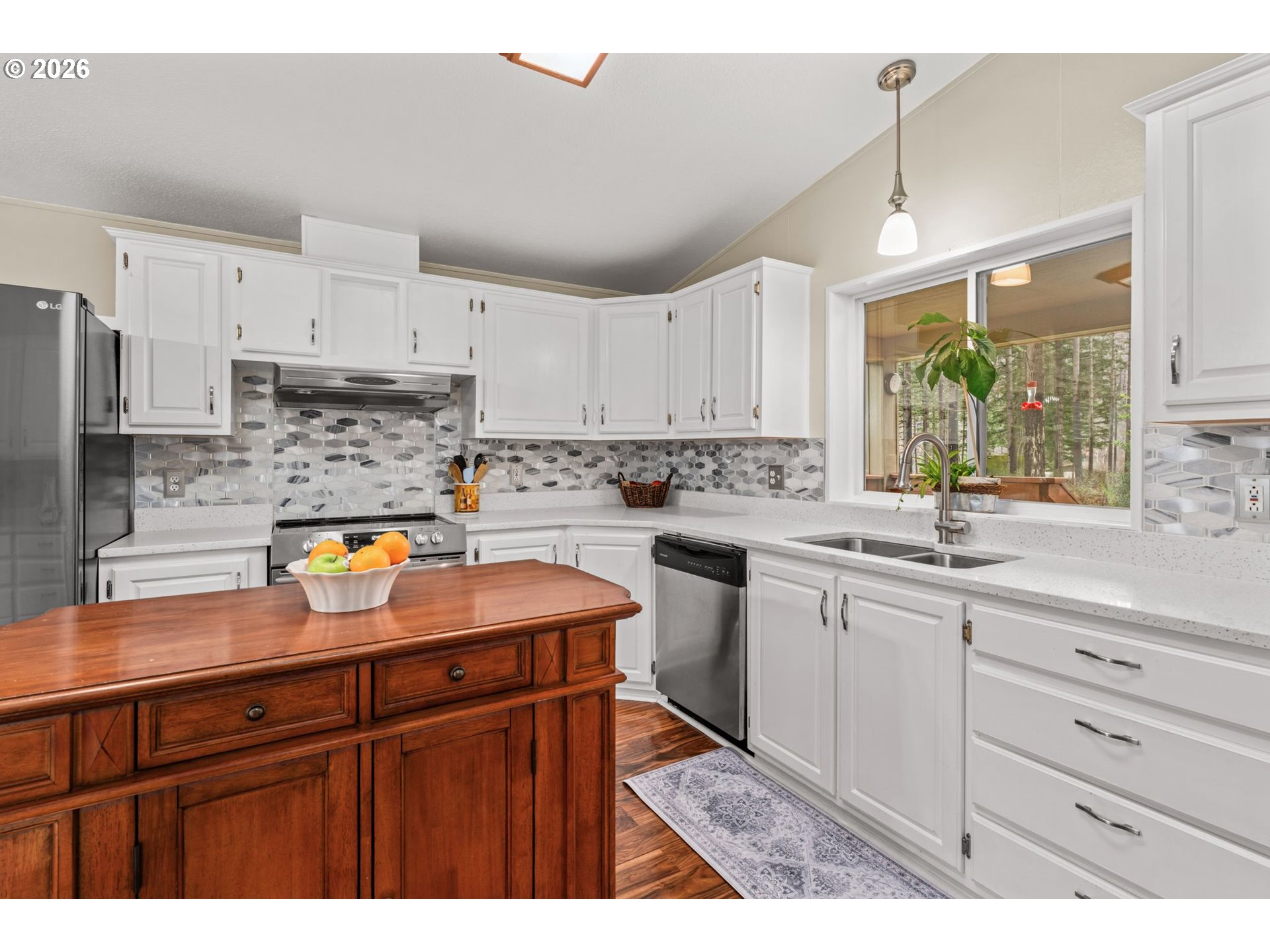 49400 Eagle Rock Place Vida, OR 97488 - Photo 10 of 48 a kitchen with stainless steel appliances granite countertop a sink stove and cabinets