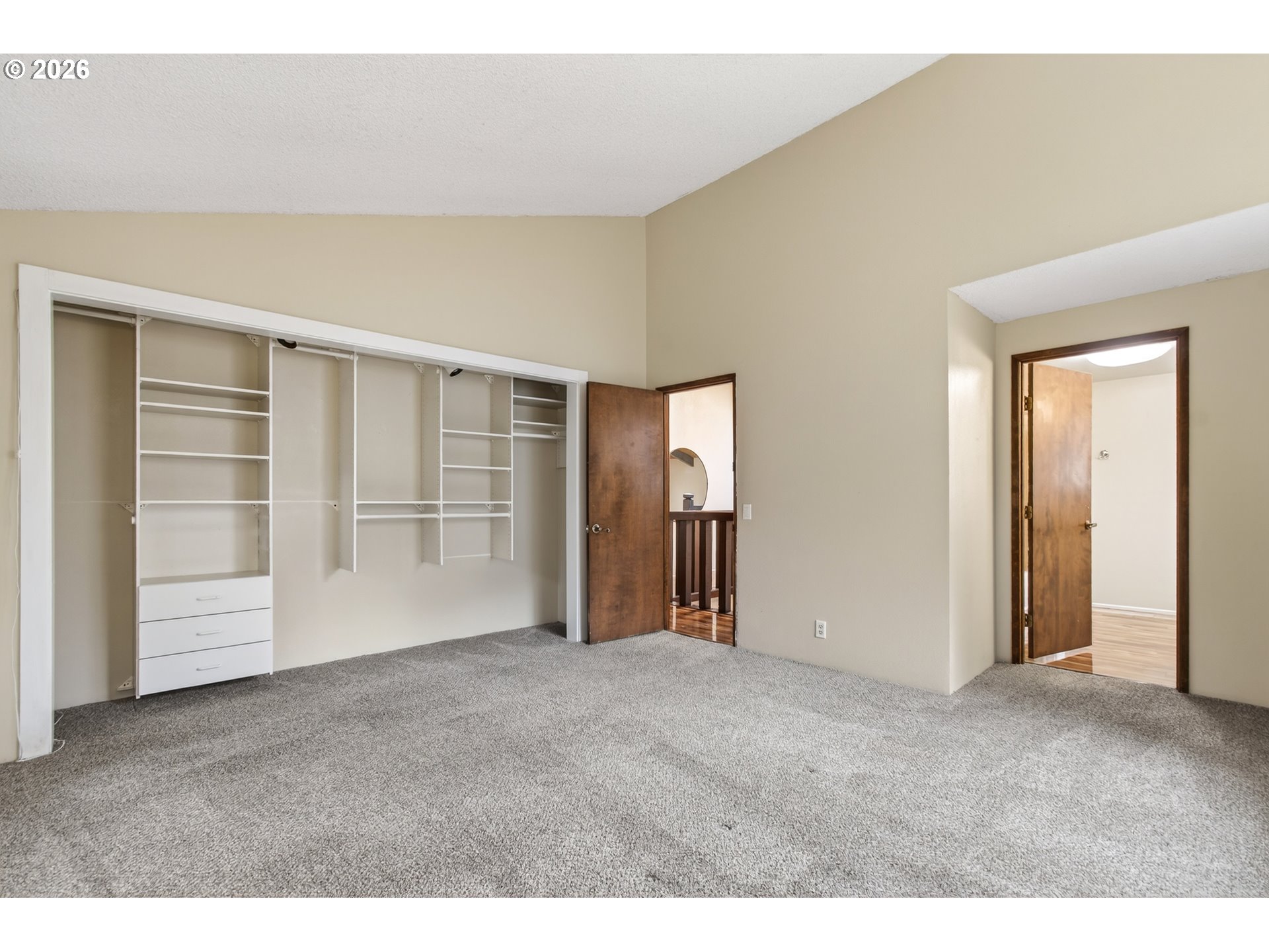 2090 Graham Drive Eugene, OR 97405 - Photo 14 of 30 a view of an empty room with wooden floor and closet