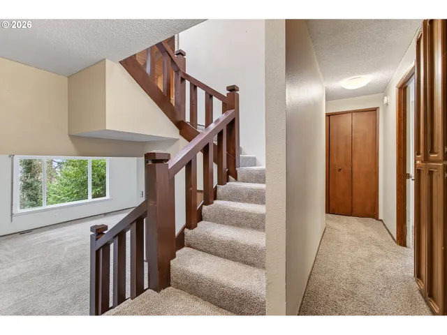 a view interior of a house with wooden floor stairs and windows