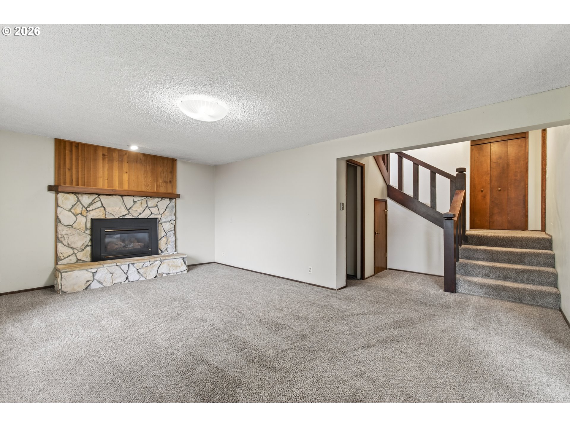 2090 Graham Drive Eugene, OR 97405 - Photo 19 of 30 a view of an empty room with a fireplace