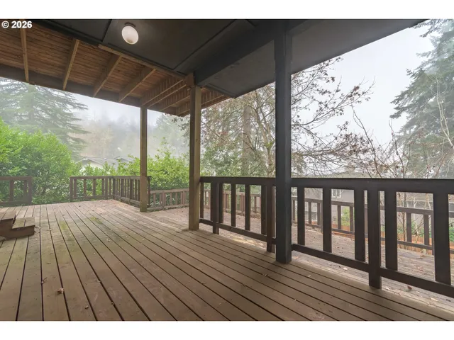 a view of balcony with wooden floor
