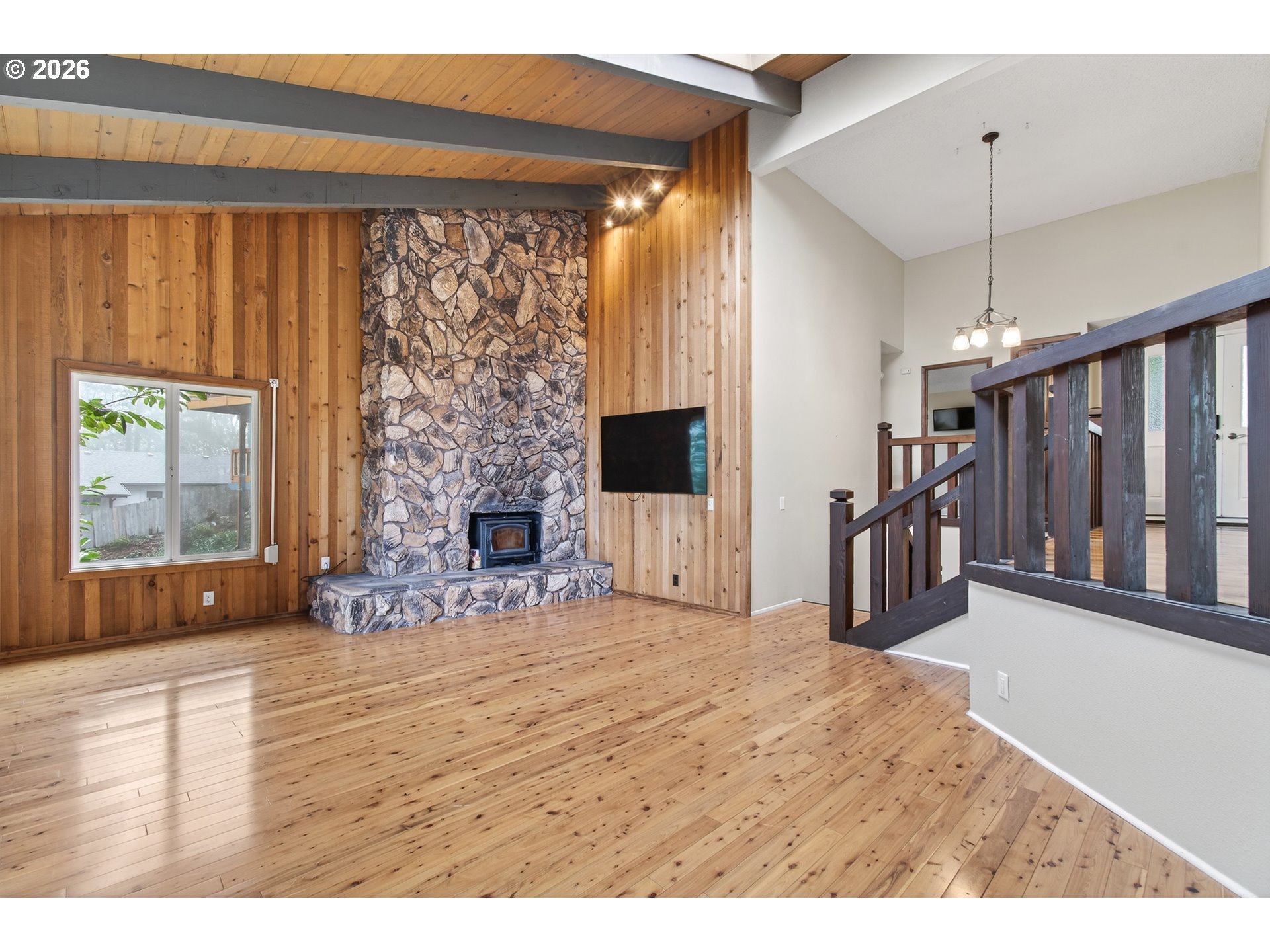 2090 Graham Drive Eugene, OR 97405 - Photo 5 of 30 a view of an empty room with wooden floor and a window