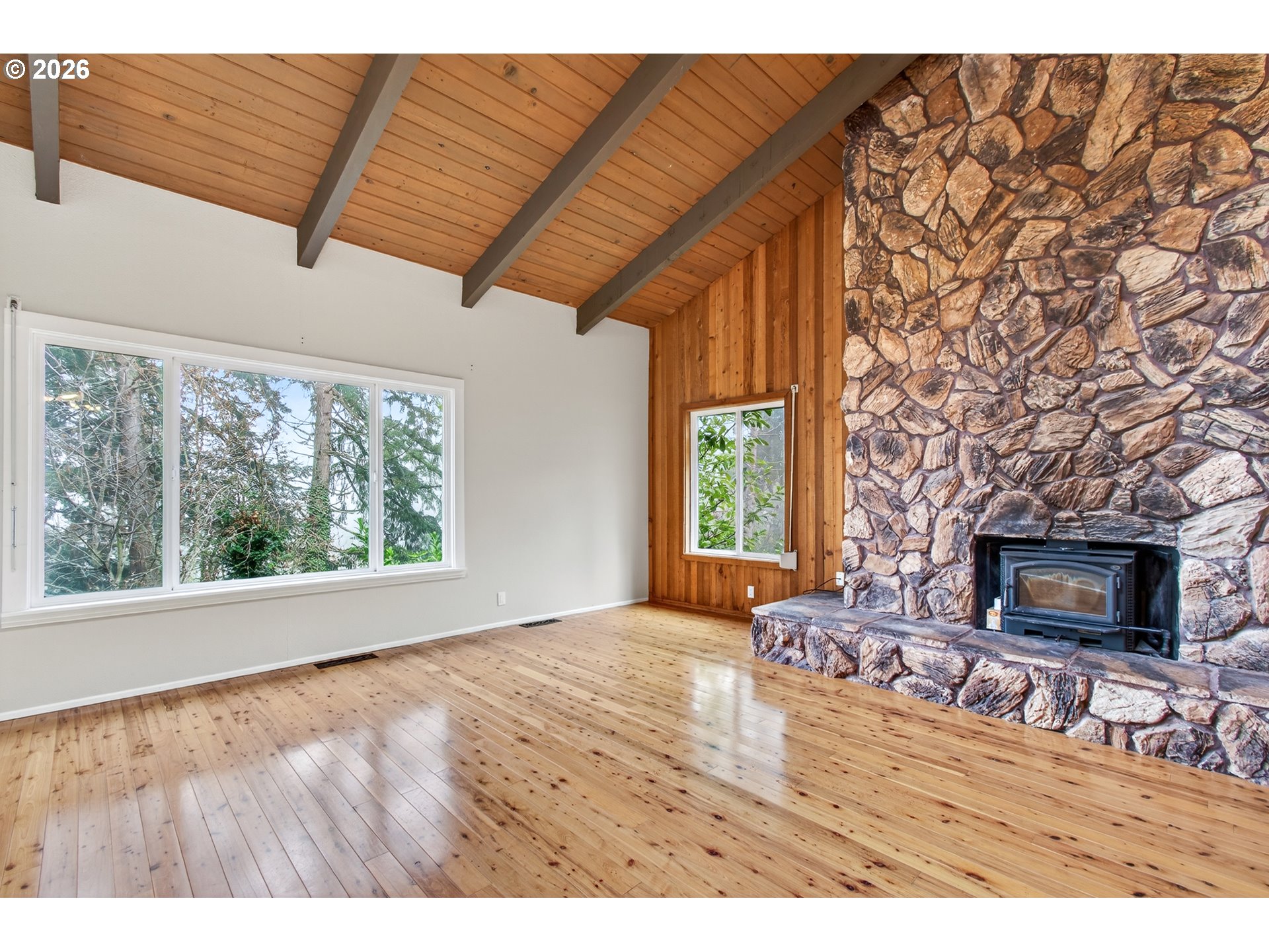 2090 Graham Drive Eugene, OR 97405 - Photo 6 of 30 a living room with furniture a flat screen tv and a fireplace