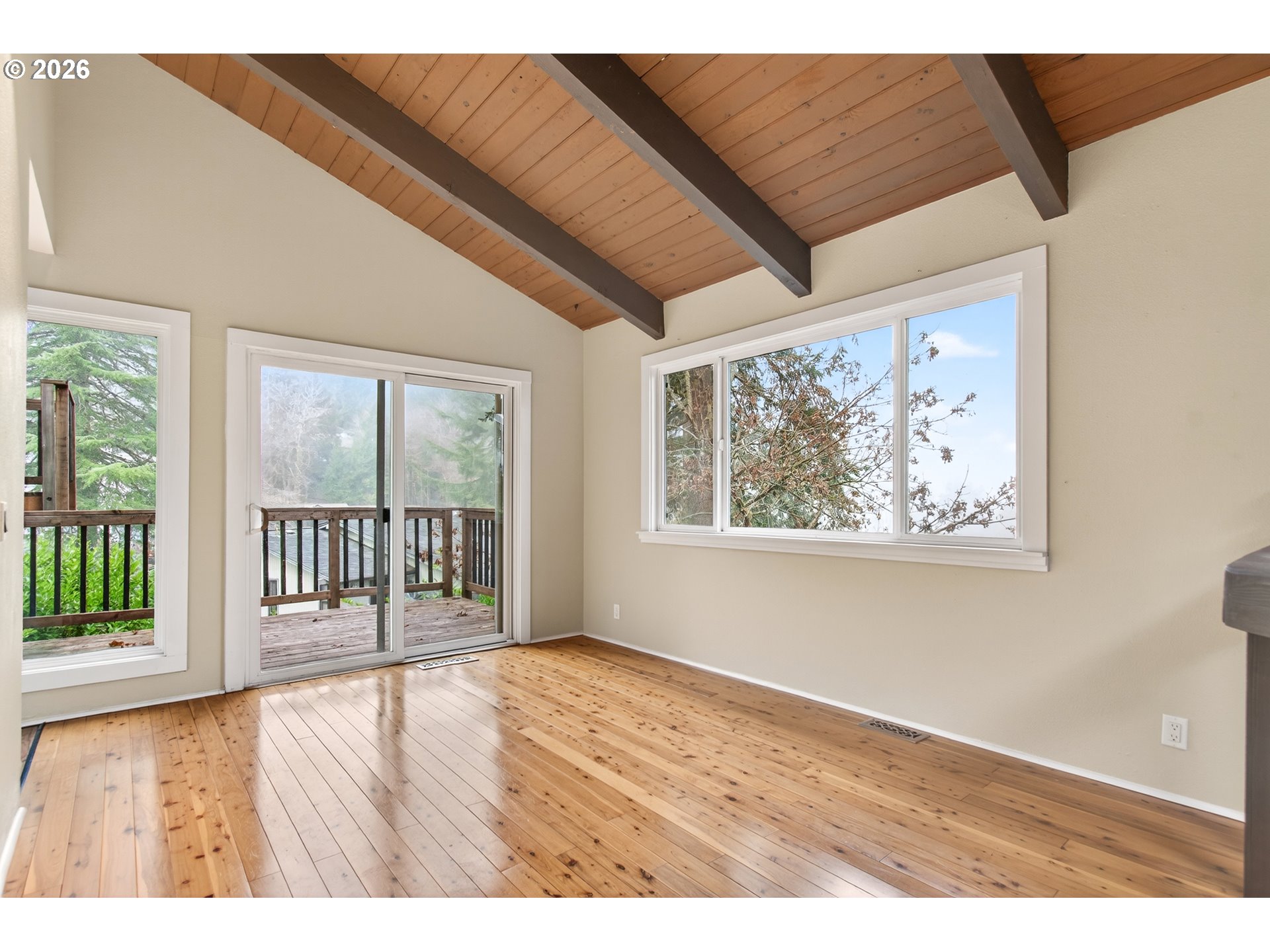 2090 Graham Drive Eugene, OR 97405 - Photo 7 of 30 a view of an empty room with wooden floor and a window