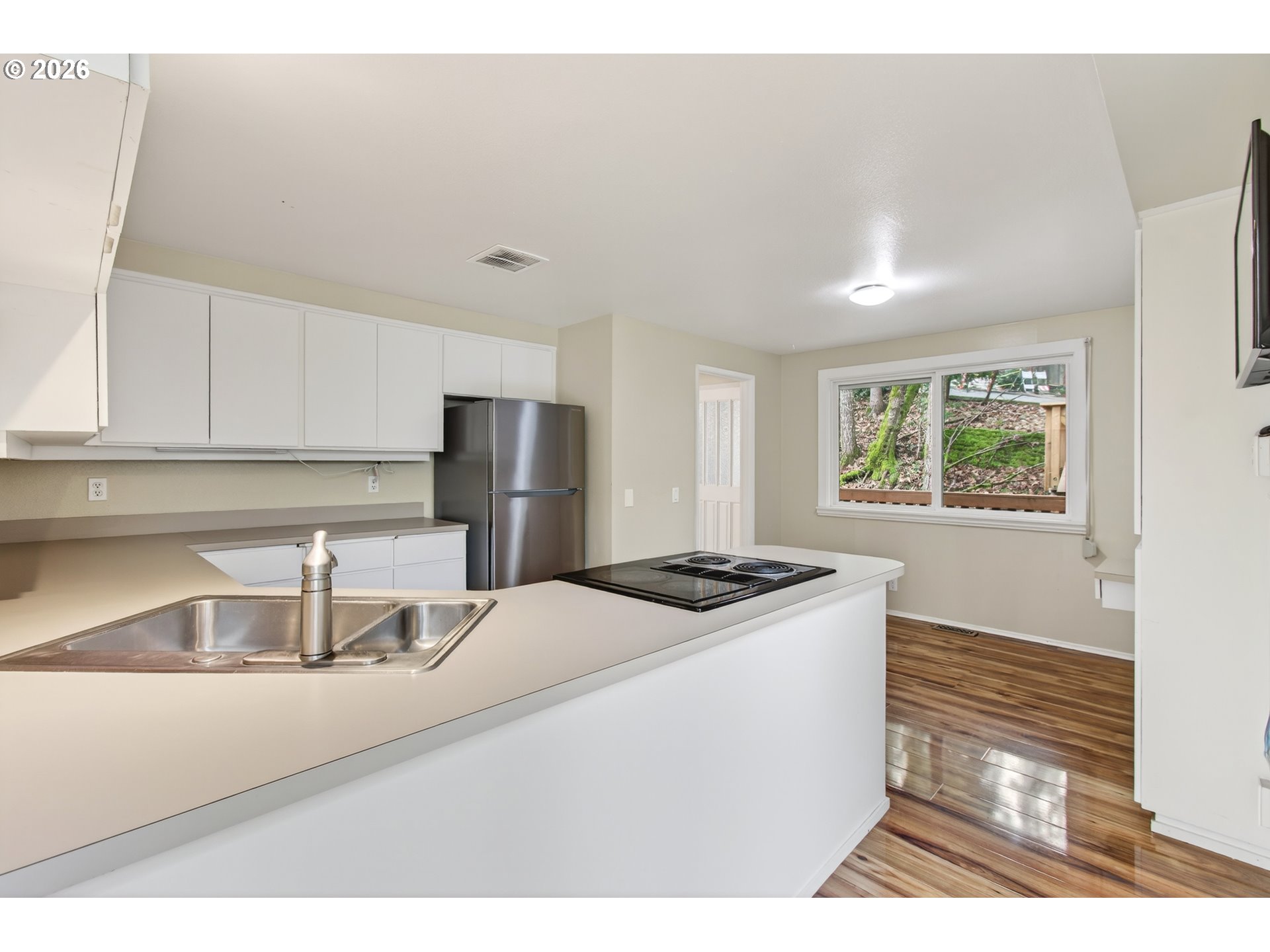 2090 Graham Drive Eugene, OR 97405 - Photo 8 of 30 a kitchen with stainless steel appliances granite countertop a sink and a refrigerator